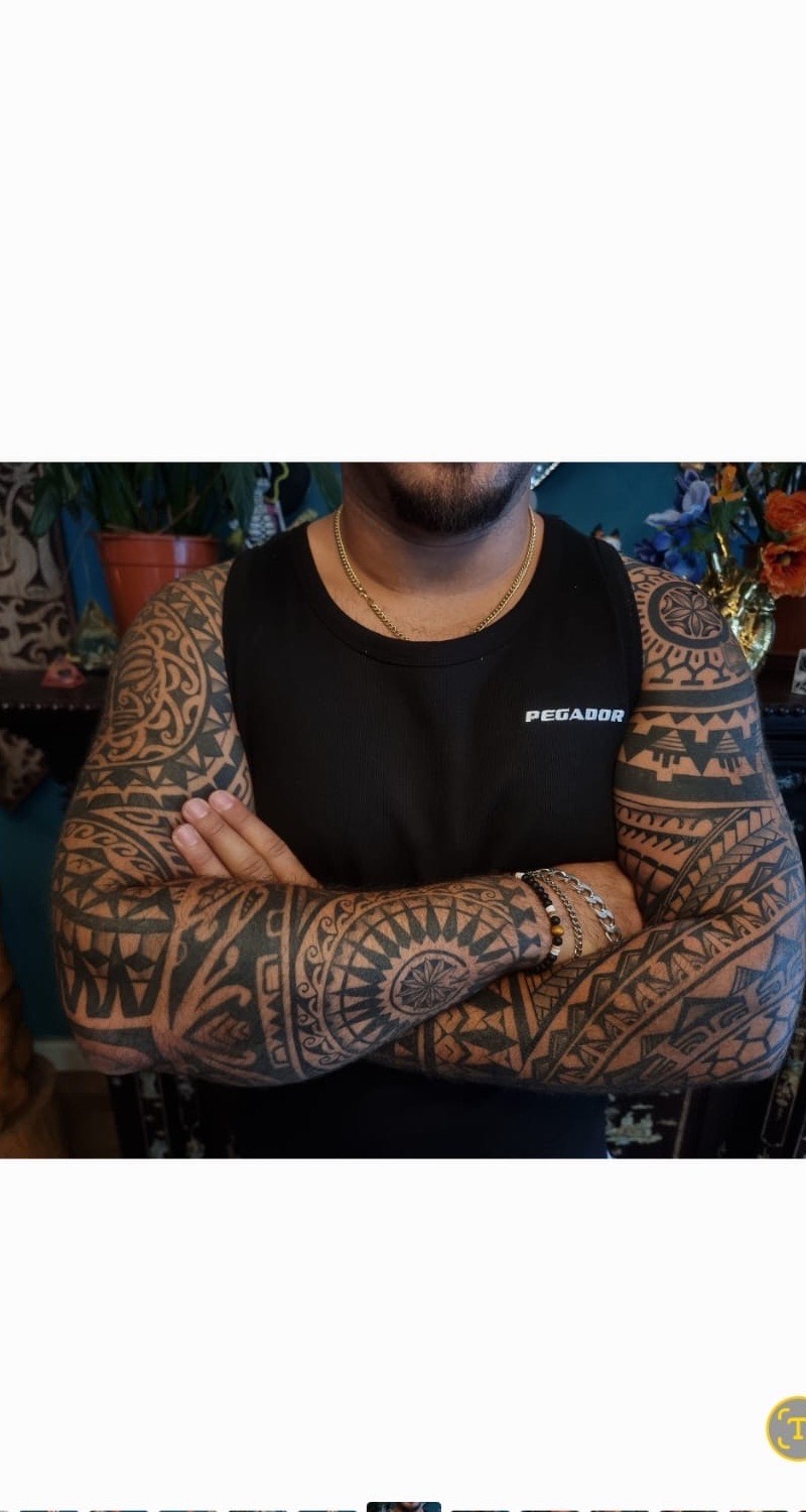 Polynesian double sleeve tattoos